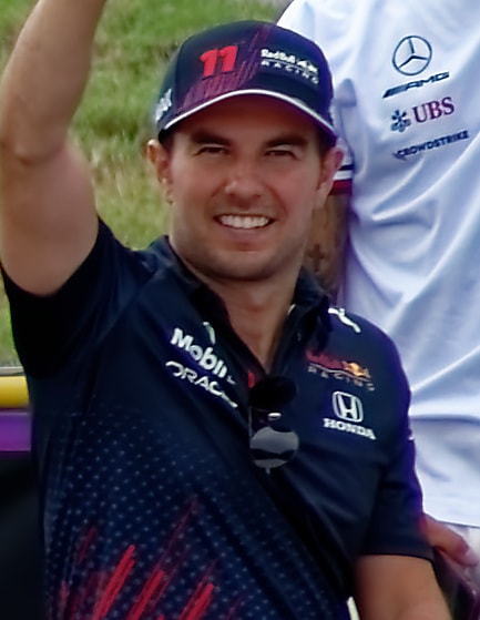 "2021 US GP driver parade (cropped2)", licensed under CC BY-SA 4.0.